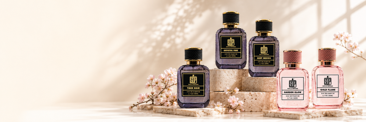 Save On Perfumes fragrance collection displayed on cream stone platforms with blossoms